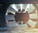 A massive turbine designed for underwater installation represents advanced tidal energy technology in a modern American industrial context.