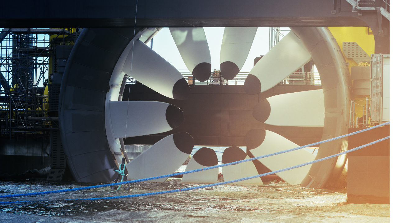 A massive turbine designed for underwater installation represents advanced tidal energy technology in a modern American industrial context.