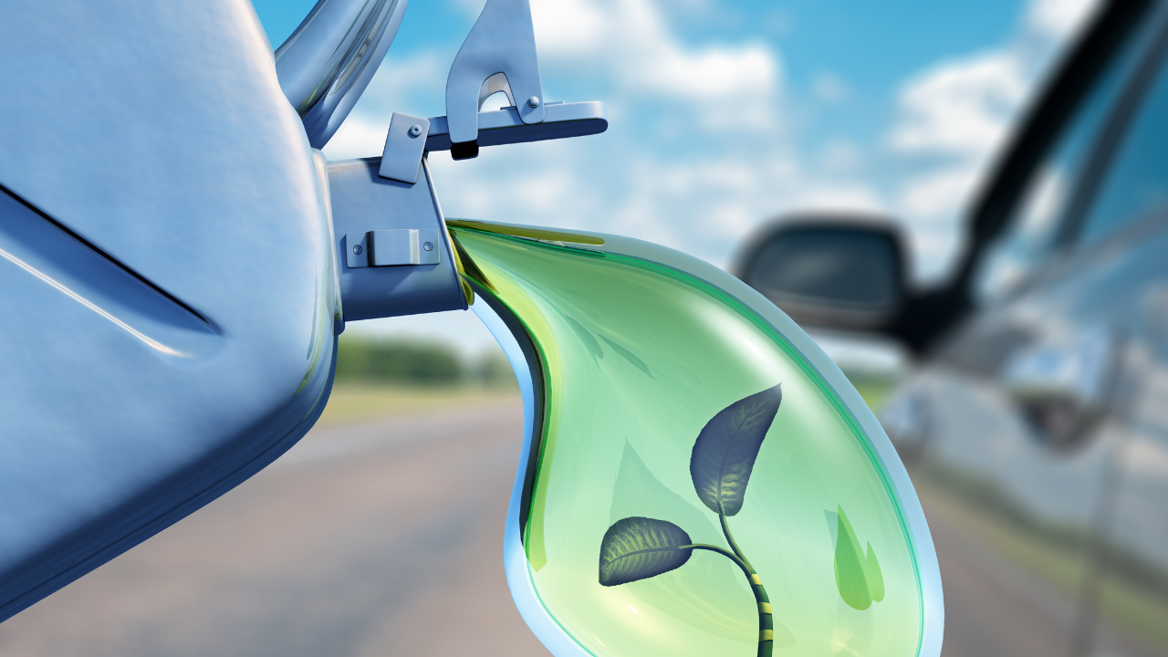 A symbolic image of a green liquid with a plant inside being poured into a car, visually representing the ecological benefits of biofuels.